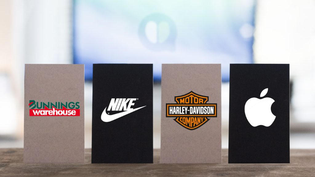 Business cards showcasing Harley-Davidson, Nike, Bunnings and Apple, demonstrating the power of consistent branding and memorable brand identity.