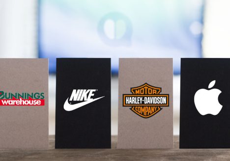 Business cards showcasing Harley-Davidson, Nike, Bunnings and Apple, demonstrating the power of consistent branding and memorable brand identity.
