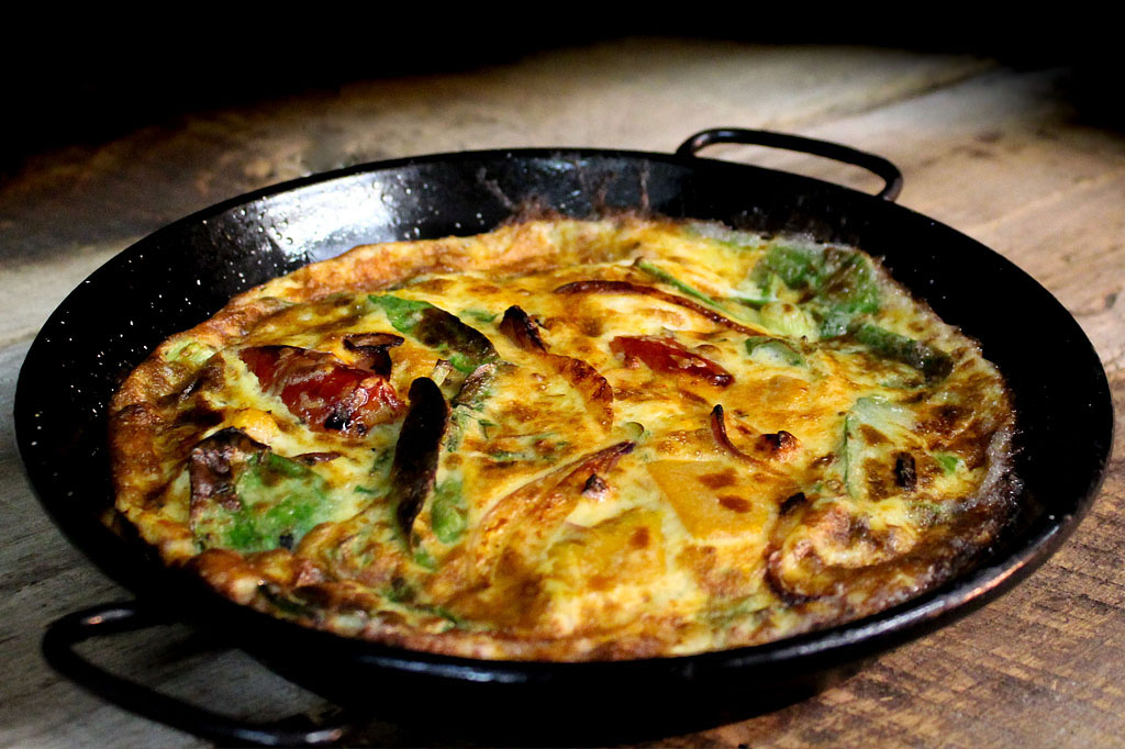 Rustic food photography of Fratelli Italian frittata showcasing authentic handmade Italian cuisine and premium hospitality branding Melbourne