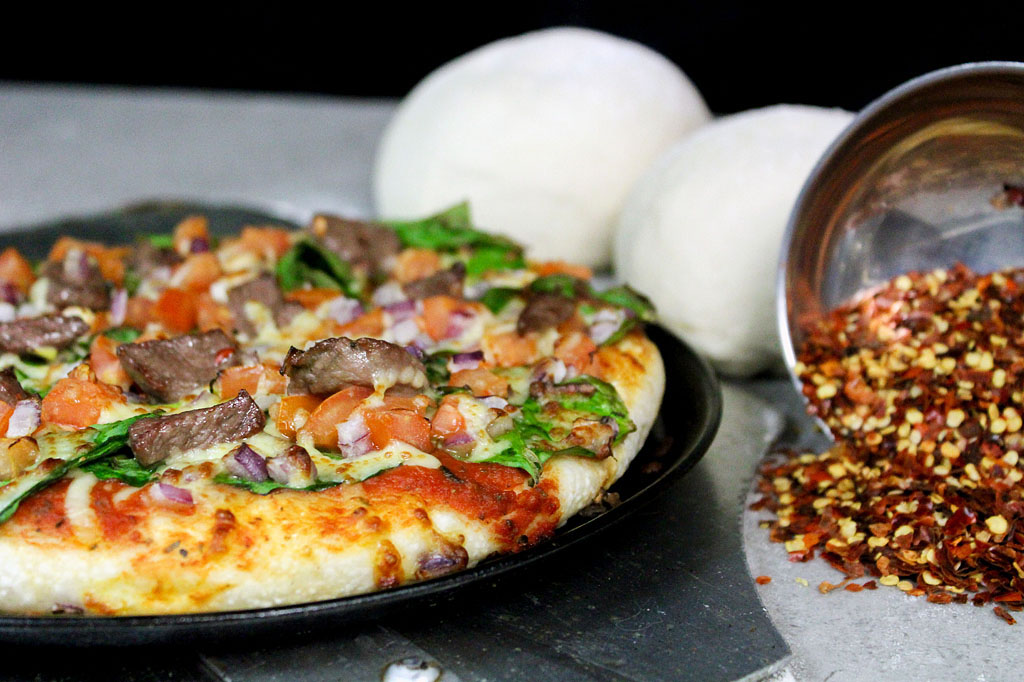 Rustic food photography of Fratelli Italian pizza showcasing authentic handmade Italian pizza ingredients and premium hospitality branding Melbourne