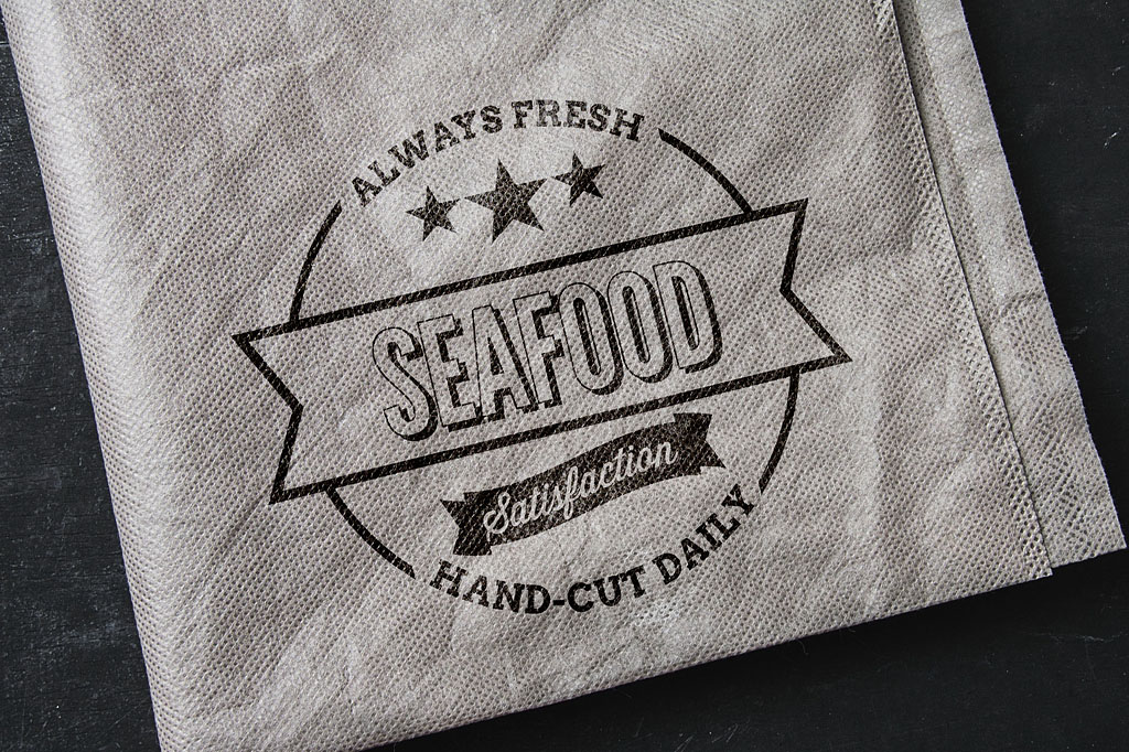 Seafood logo branding applied to food service towel as part of retro-inspired visual identity for Sofia Frankston kiosk Melbourne