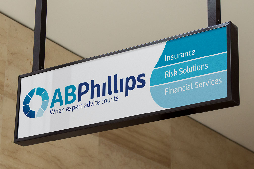 AB Phillips foyer signage showcasing corporate branding and service offerings within a professional financial services environment Melbourne