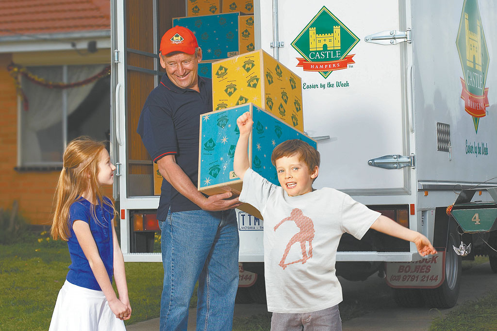 Castle Hampers delivery truck arriving before Christmas with excited children showcasing integrated advertising campaign, brand storytelling and direct marketing strategy by Melbourne freelance creative consultant