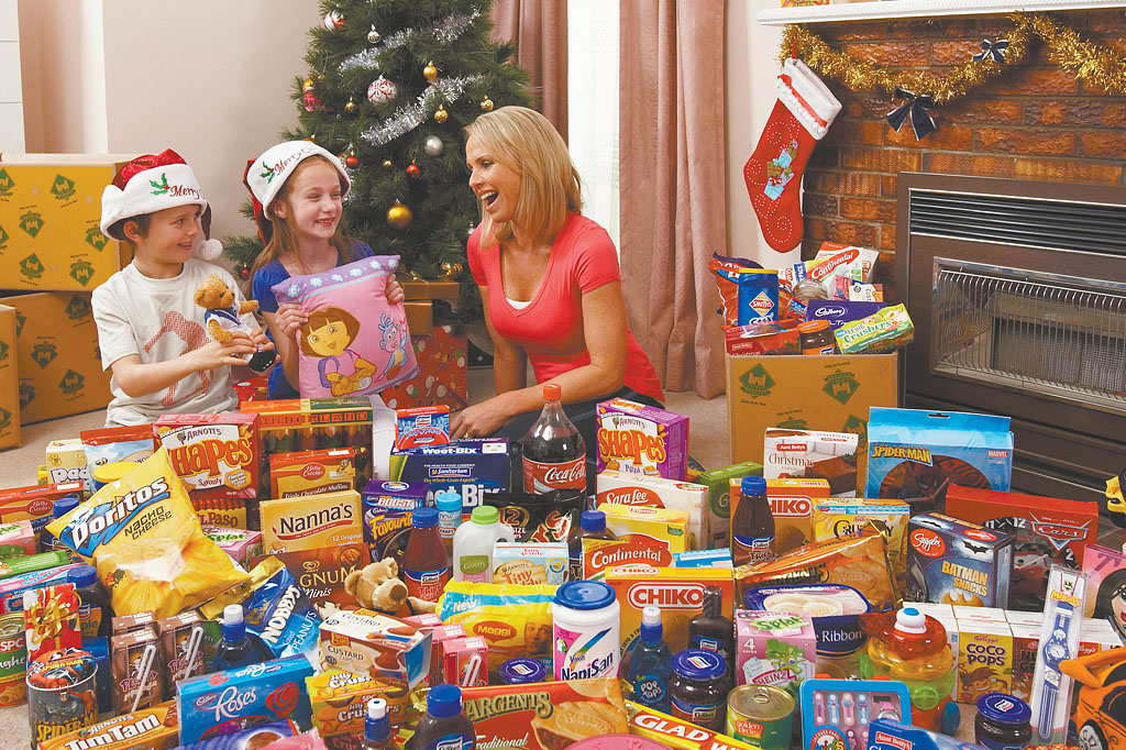 Castle Hampers lifestyle photography featuring family surrounded by groceries and Christmas treats supporting integrated advertising and brand campaign Melbourne