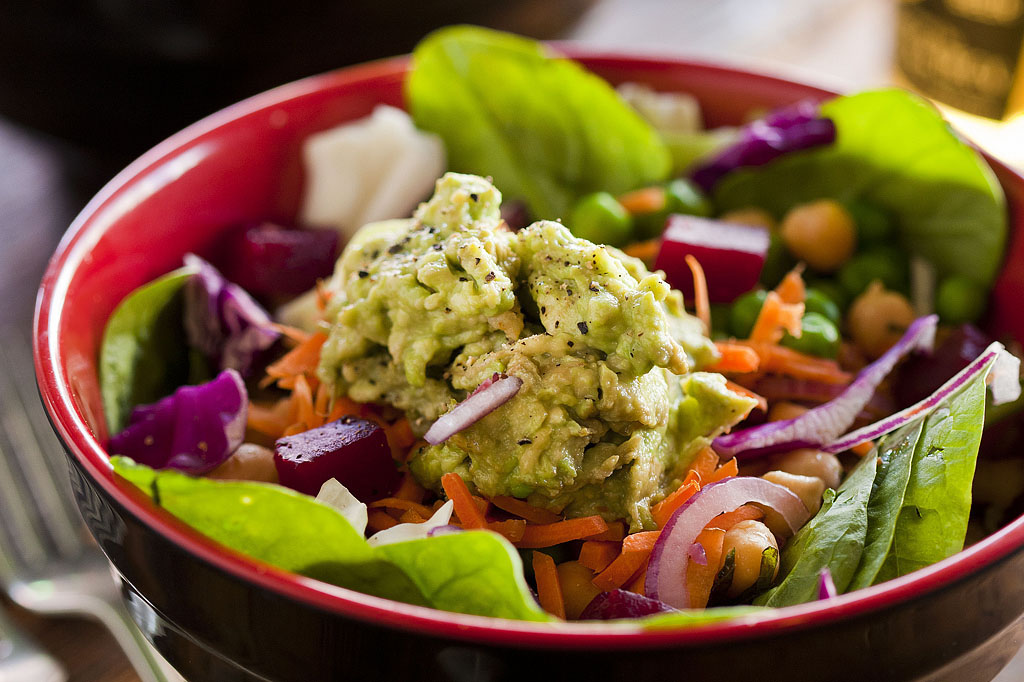 Fresh avocado and leafy greens photographed for Spudbar healthy food campaign showcasing premium ingredients and restaurant branding Melbourne