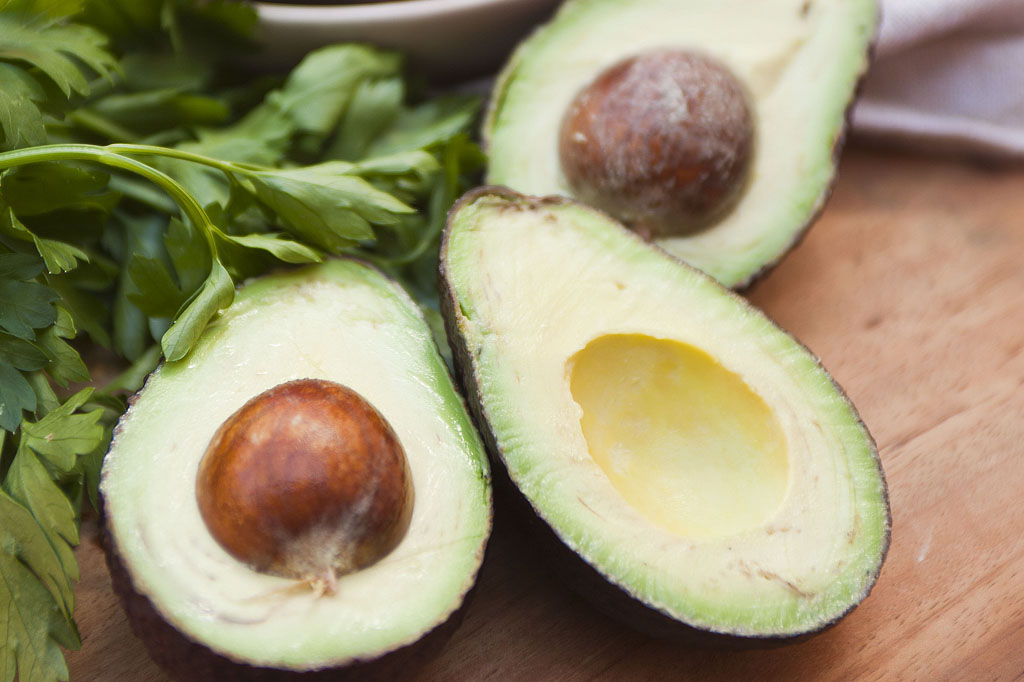 Fresh avocados featured in wholesome food photography supporting Spudbar healthy restaurant branding and flavour-focused marketing campaign