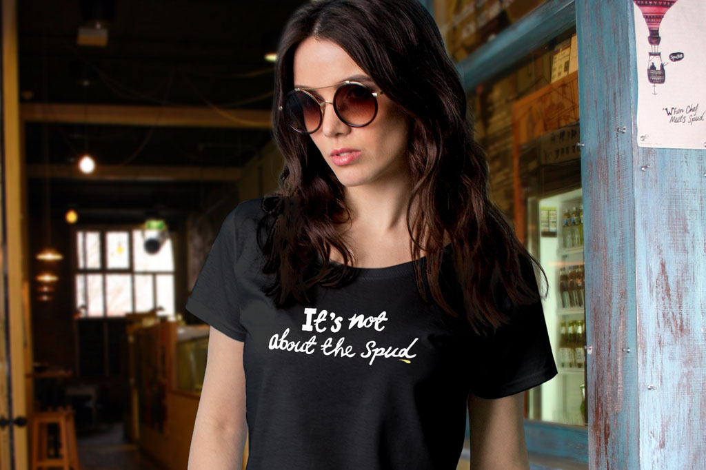 Spudbar staff member wearing 'It's Not About the Spud' campaign t-shirt demonstrating integrated restaurant branding and customer engagement strategy Melbourne