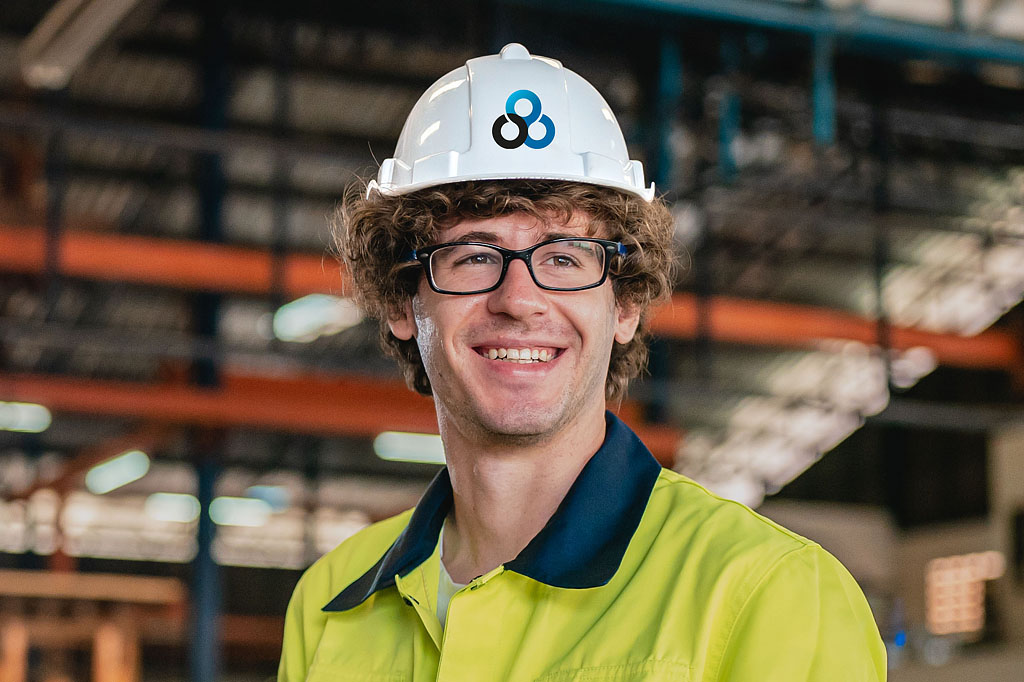 CBS branded hard hat worn on an industrial site showcasing consistent brand identity for a pipe fabrication company, reinforcing engineering branding and professional corporate design by Melbourne freelance branding consultant.